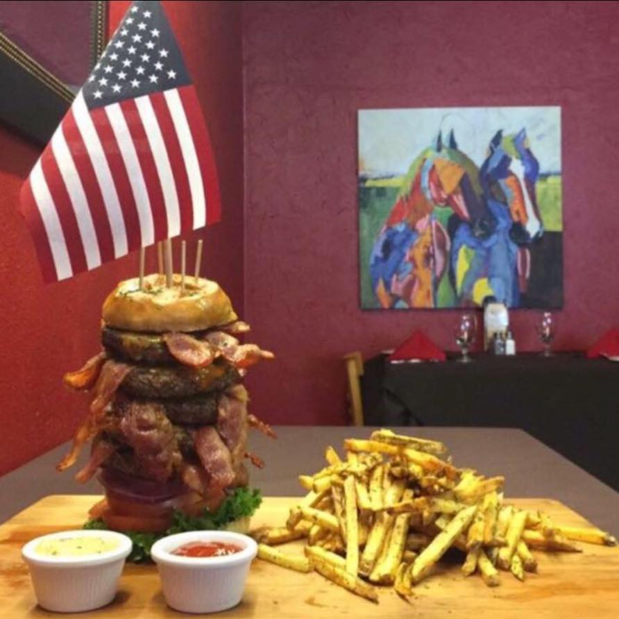 Large burger with fries at Main Street Cafe